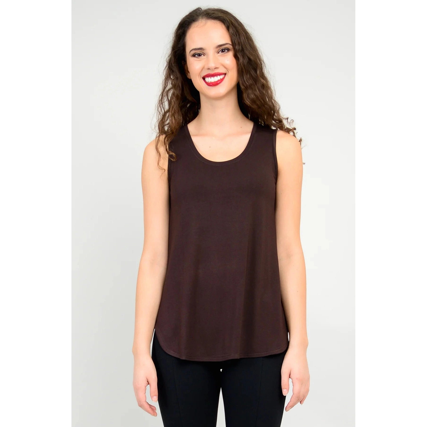 Blue Sky Jazz Tank in Coffee shown on a model wearing black leggings, against a white background, from the front view.