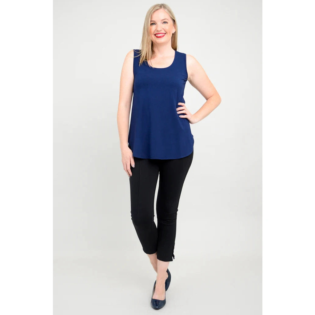 Blue Sky Jazz Tank in Indigo shown on a model wearing black leggings standing against a white background, from the front view.