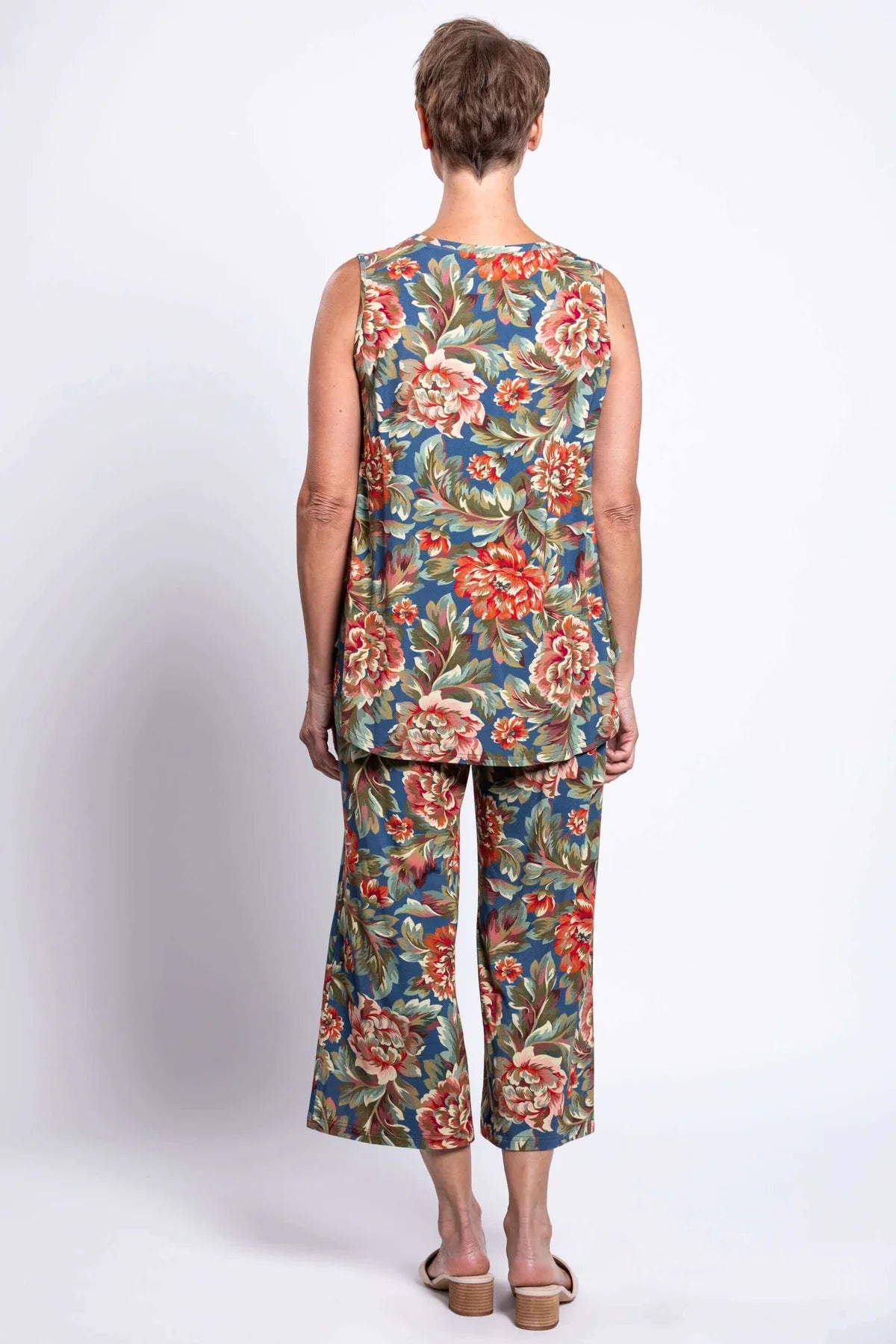 Blue Sky Jazz Tank in Vintage Khaki print shown on a model wearing matching capris, against a white background, shown from the back view.