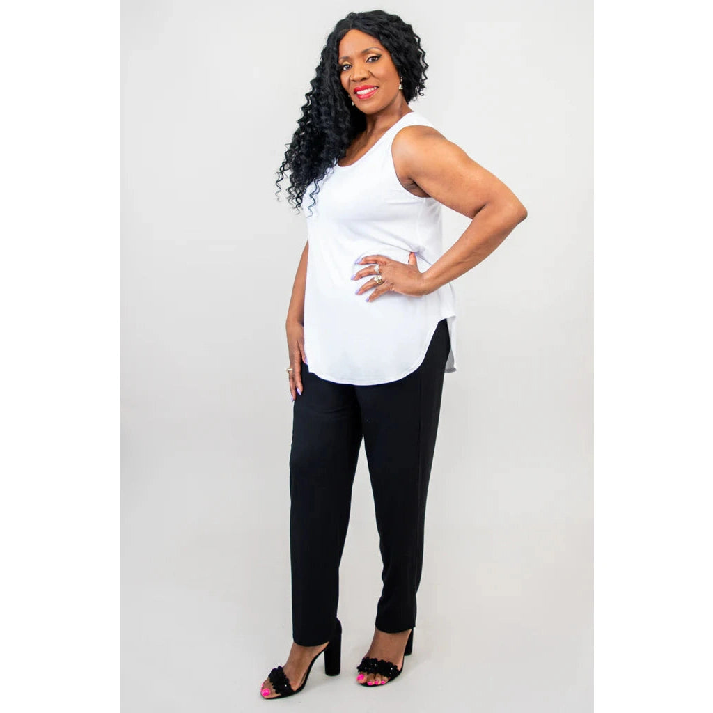 Blue Sky Jazz Tank in White shown on a model wearing black leggings standing against a white background, from the front view.