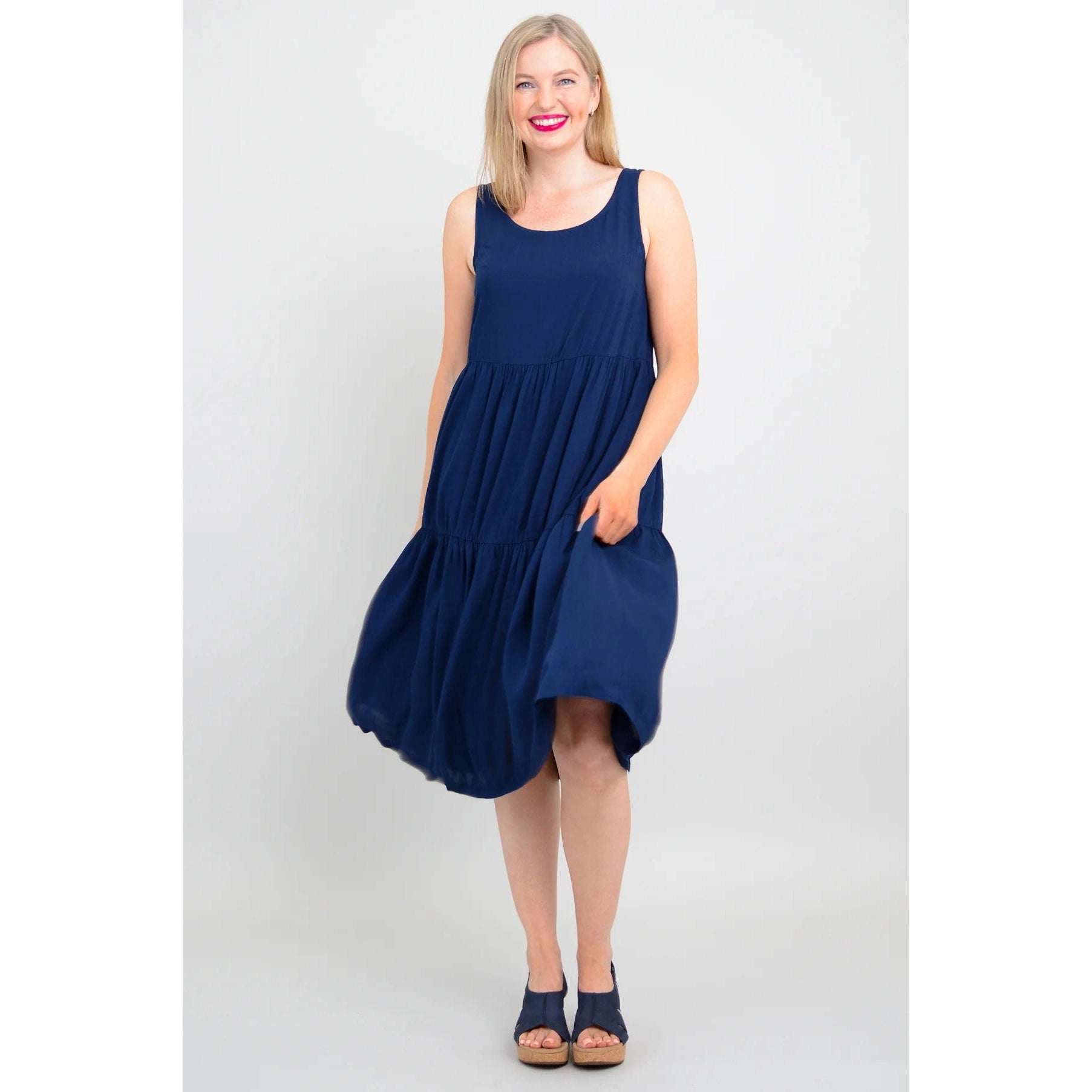 Blue Sky Juni Dress in Indigo shown on a model against a white background, from the front view.