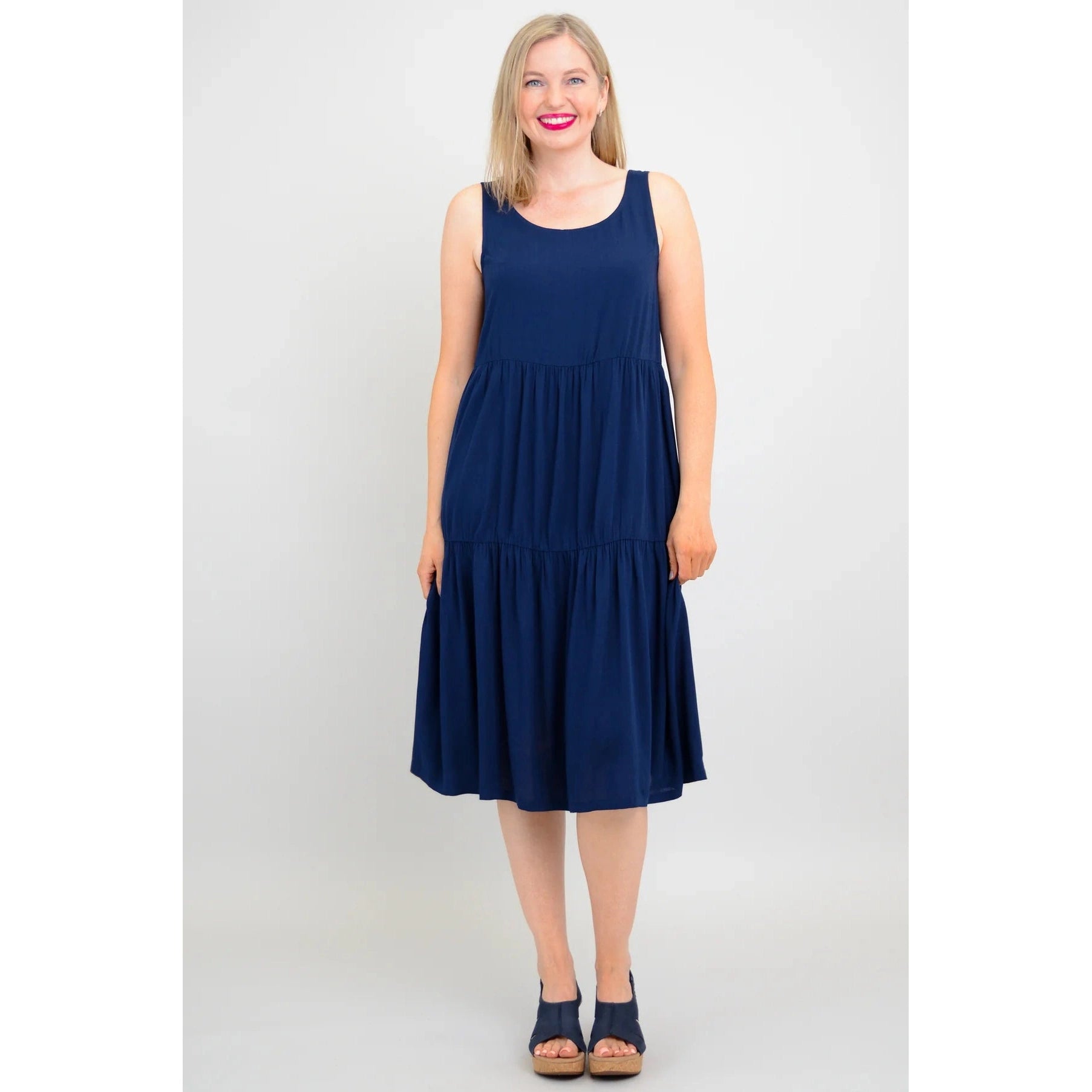 Blue Sky Juni Dress in Indigo shown on a model against a white background, from the front view.