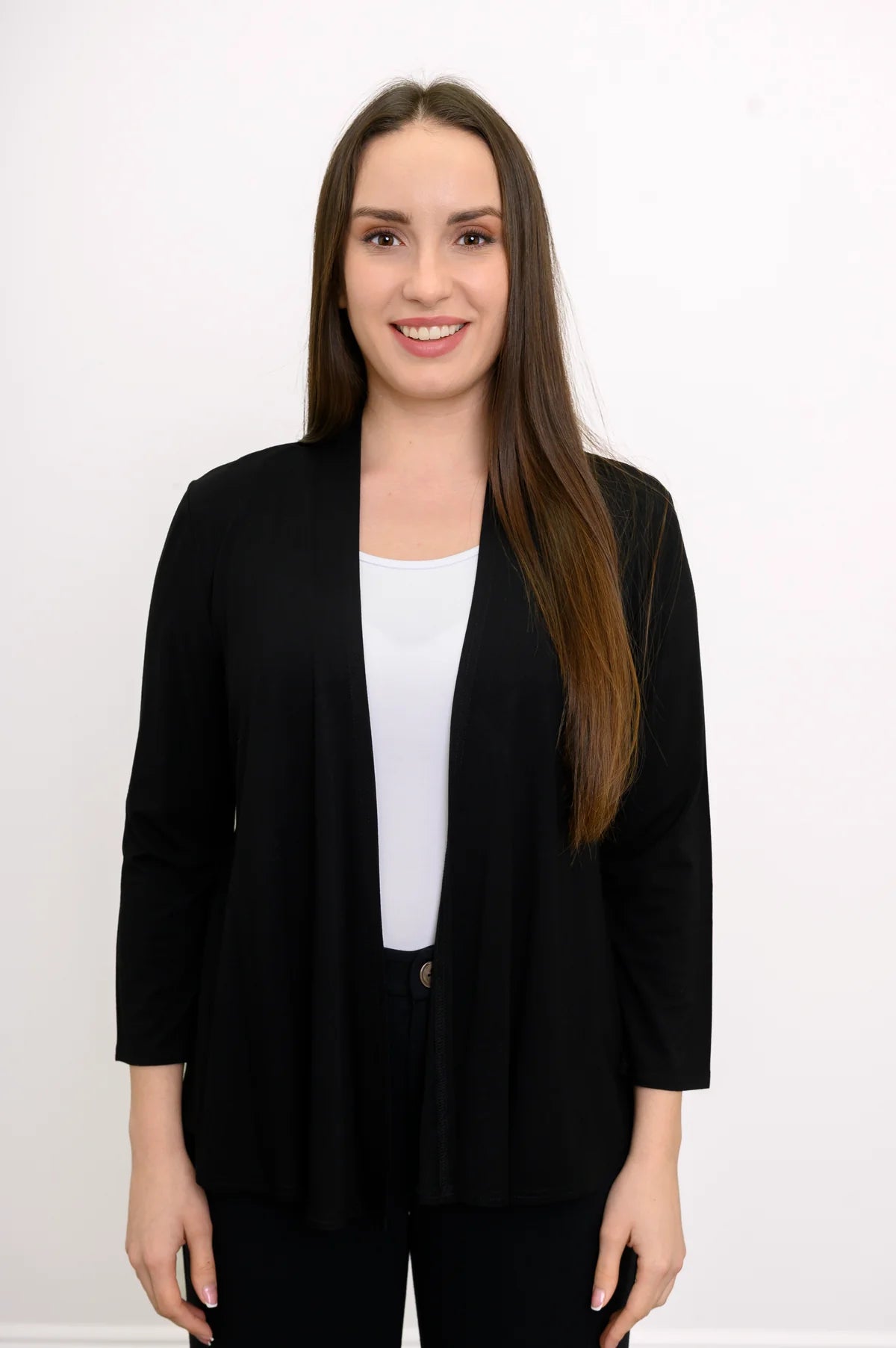 Blue Sky Kathy Jacket in Black shown on a model wearing it over a white tank with black pants against a white background, shown from the front.