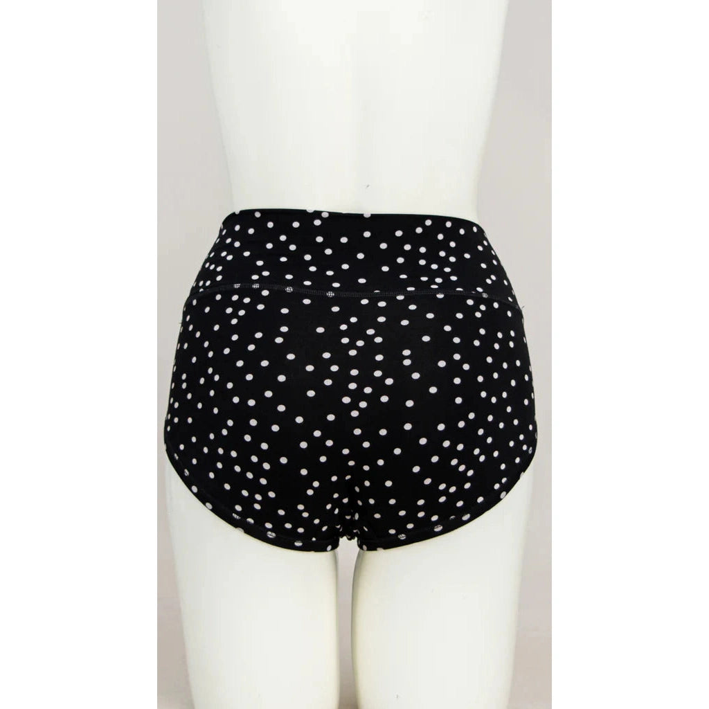 Blue Sky La Gaunche Full Brief in Polka, black panty with white dots pattern, shown on a mannequin against a white background, from the back view.