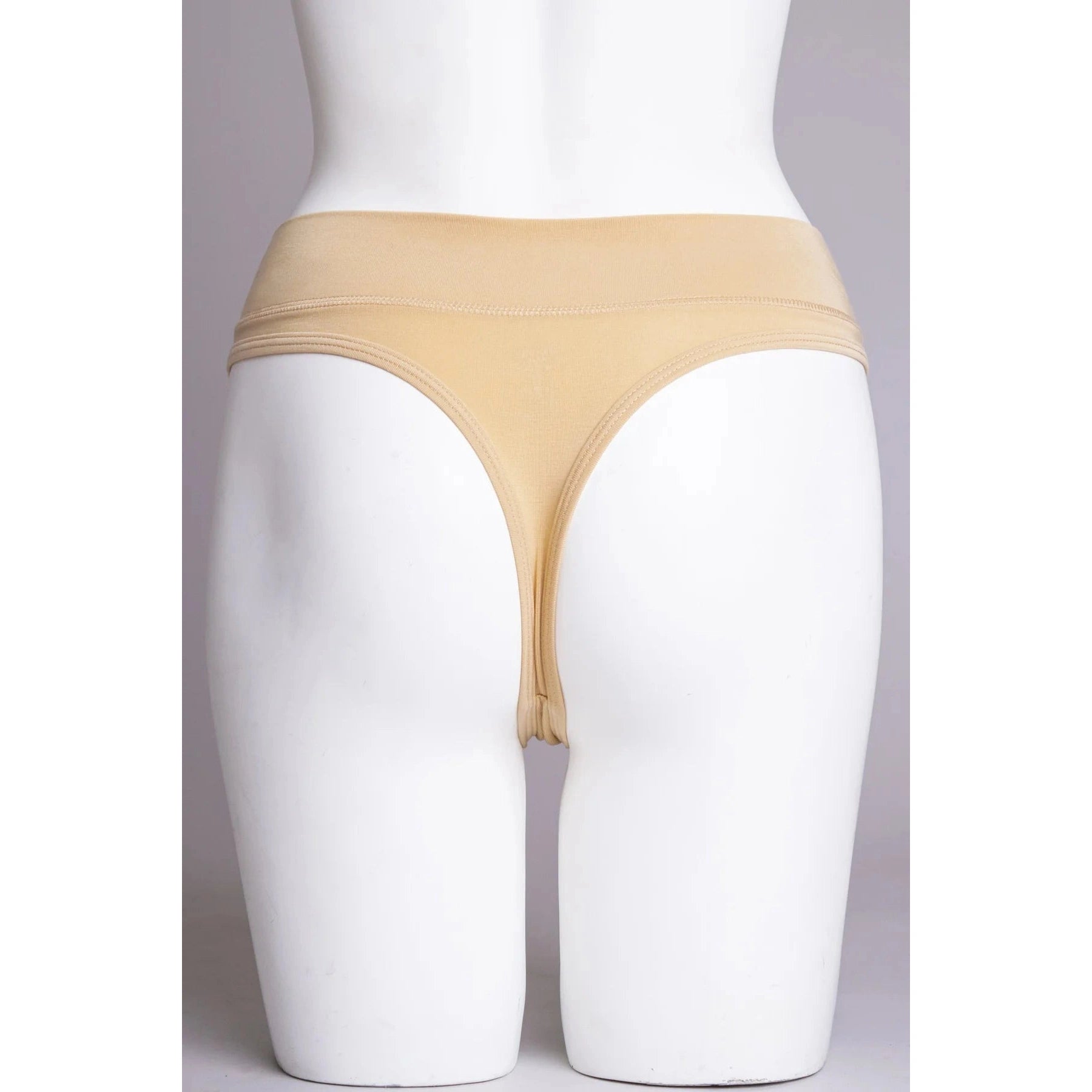Blue Sky La Thong in Beige shown on a mannequin against a white background, showing the back view.