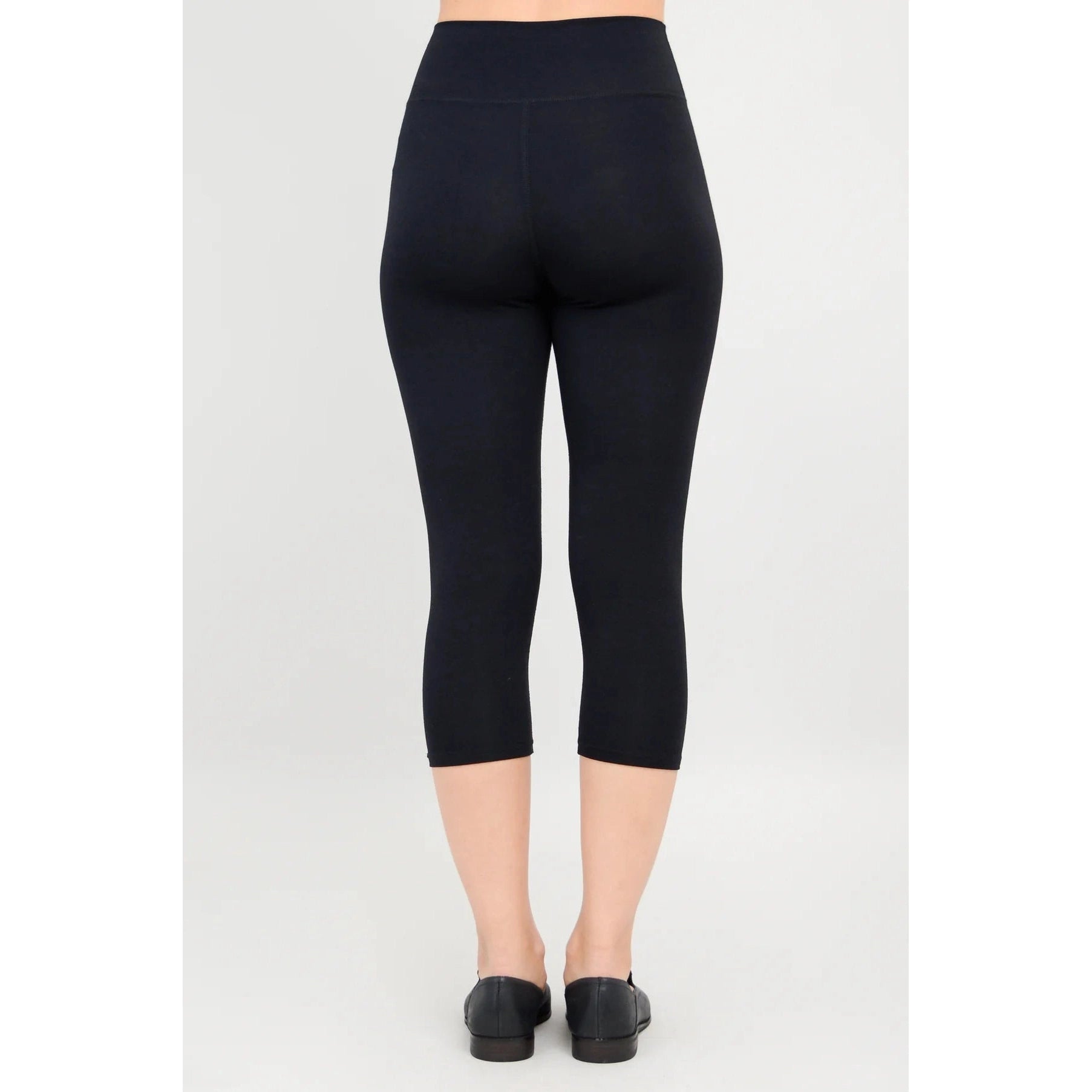 Blue Sky Riley Capris in Black shown on a model against a white background, from the back view.
