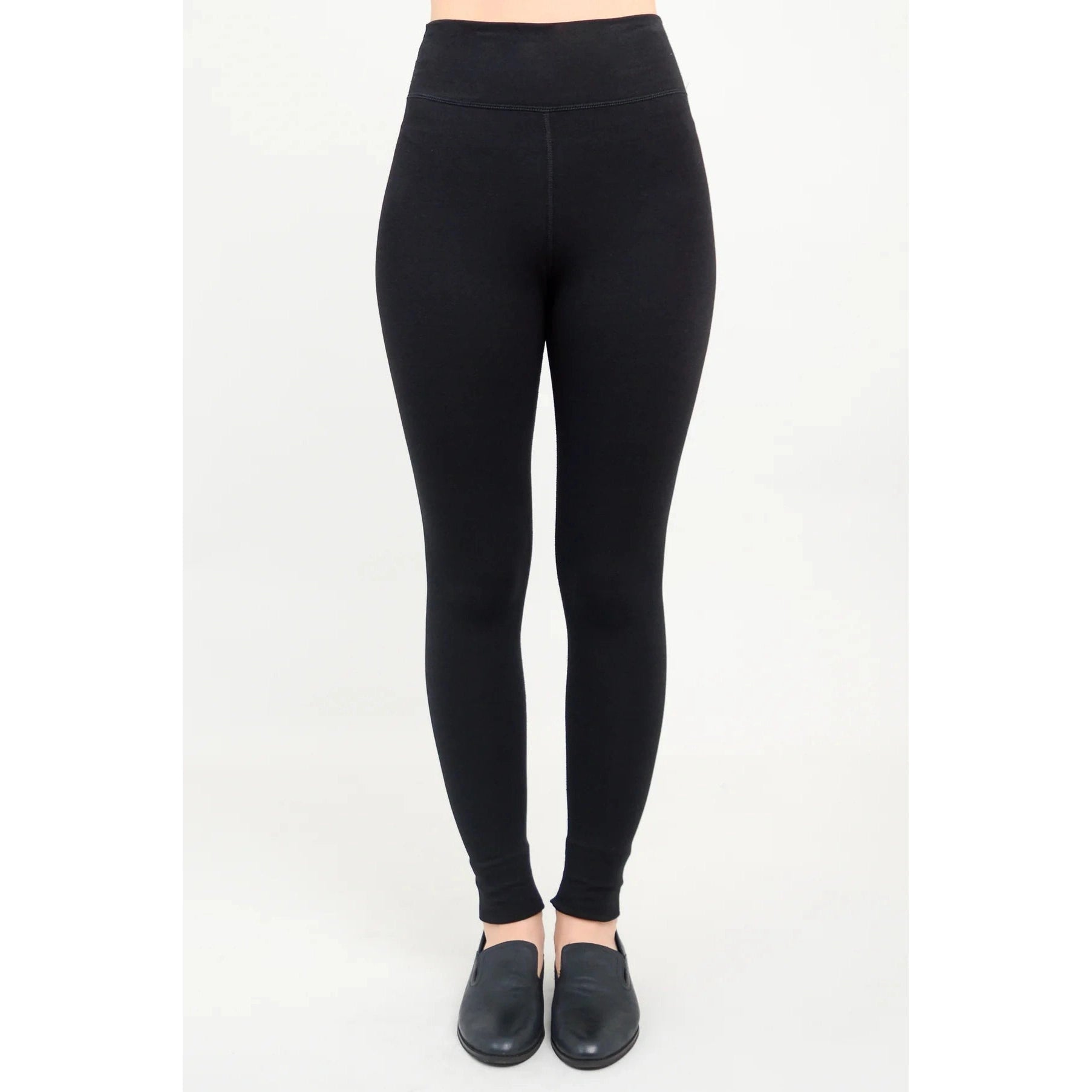 Blue Sky Riley Leggings in Black shown on a model against a white background, from the front view.