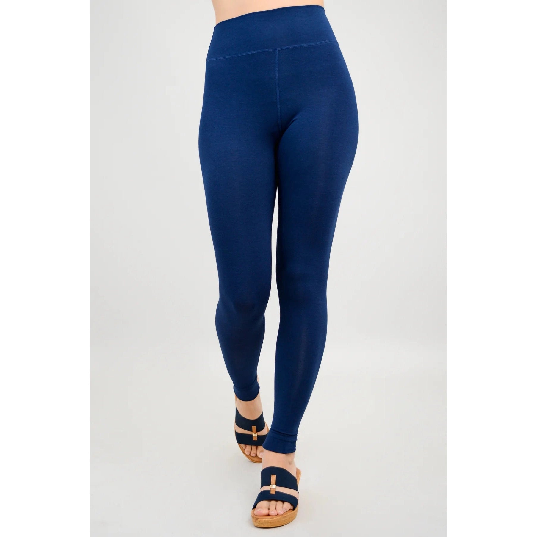 Blue Sky Riley Leggings in Indigo shown on a model against a white background, from the front view.