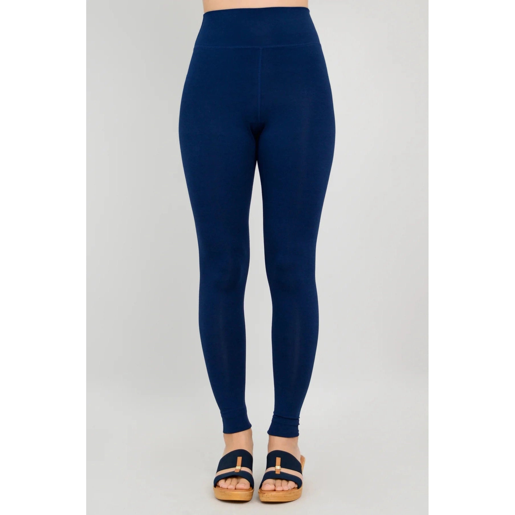 Blue Sky Riley Leggings in Indigo shown on a model against a white background, from the front view.
