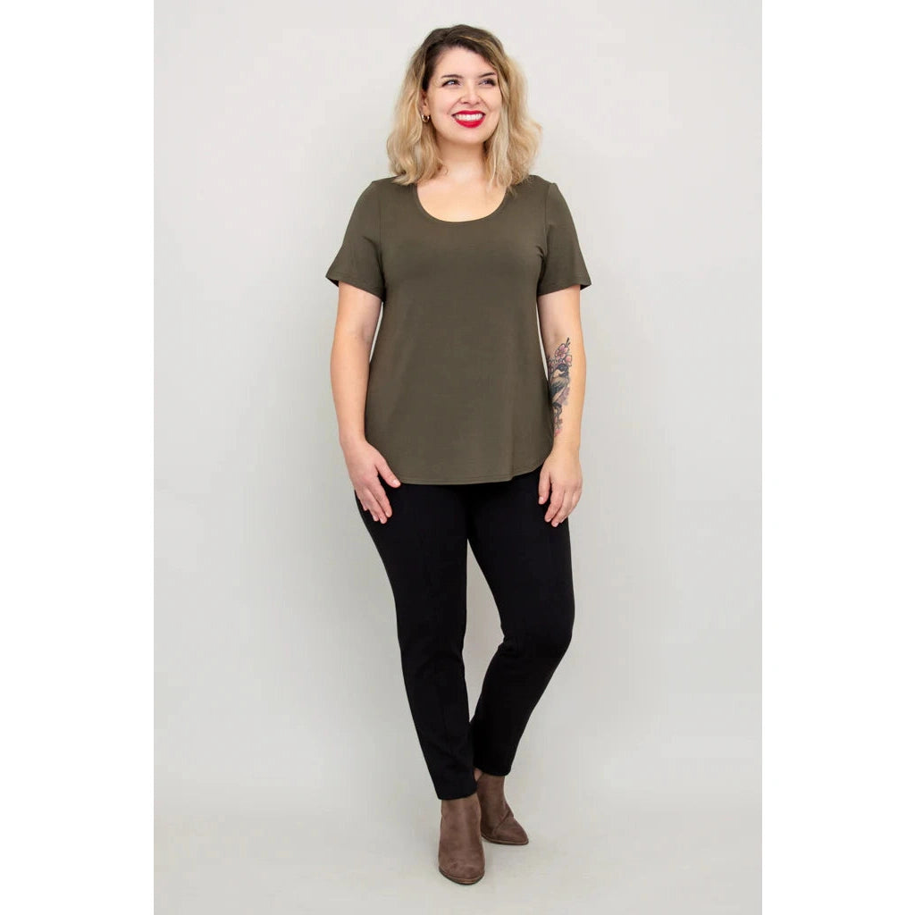 Blue Sky Tessa Tee in Khaki shown on a model wearing black leggings against a white background, from the front view.