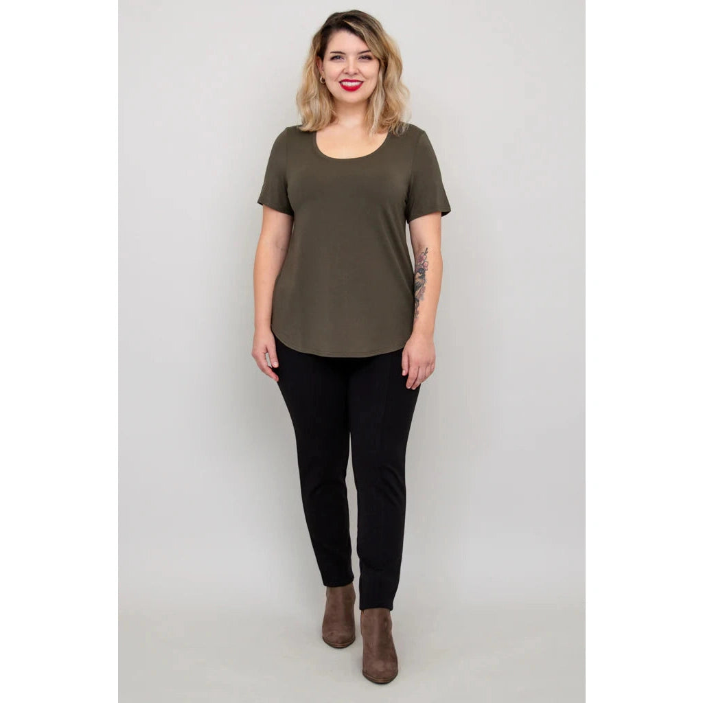 Blue Sky Tessa Tee in Khaki shown on a model wearing black leggings against a white background, from the front view.