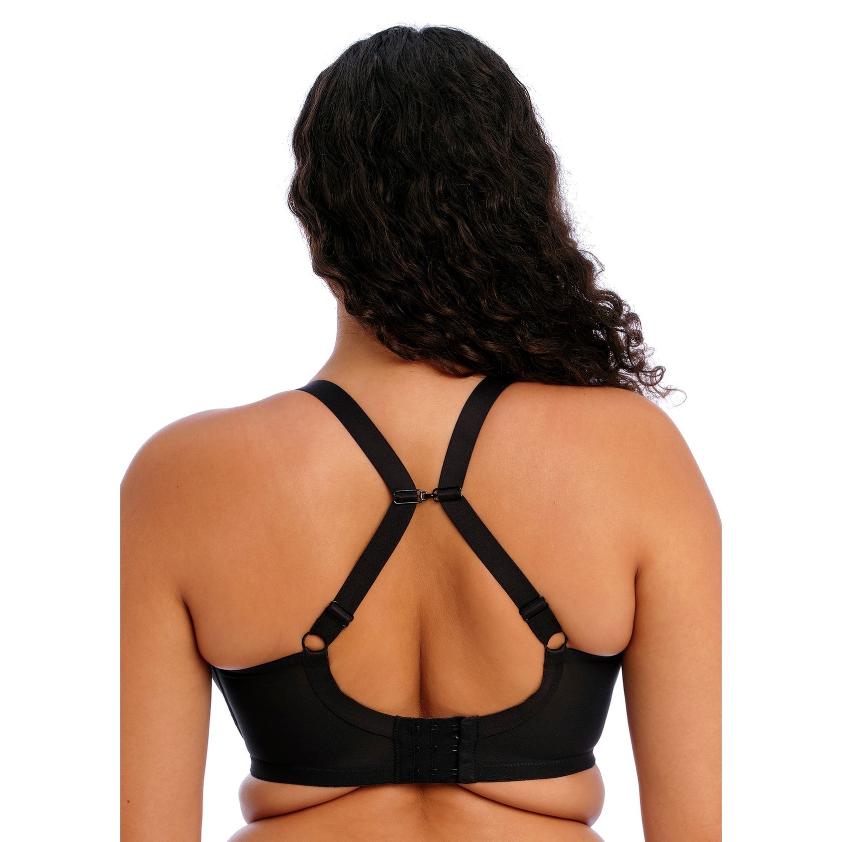 Woman wearing the Elomi Energise Sports Bra in black with a view of the back, straps racer-backed.