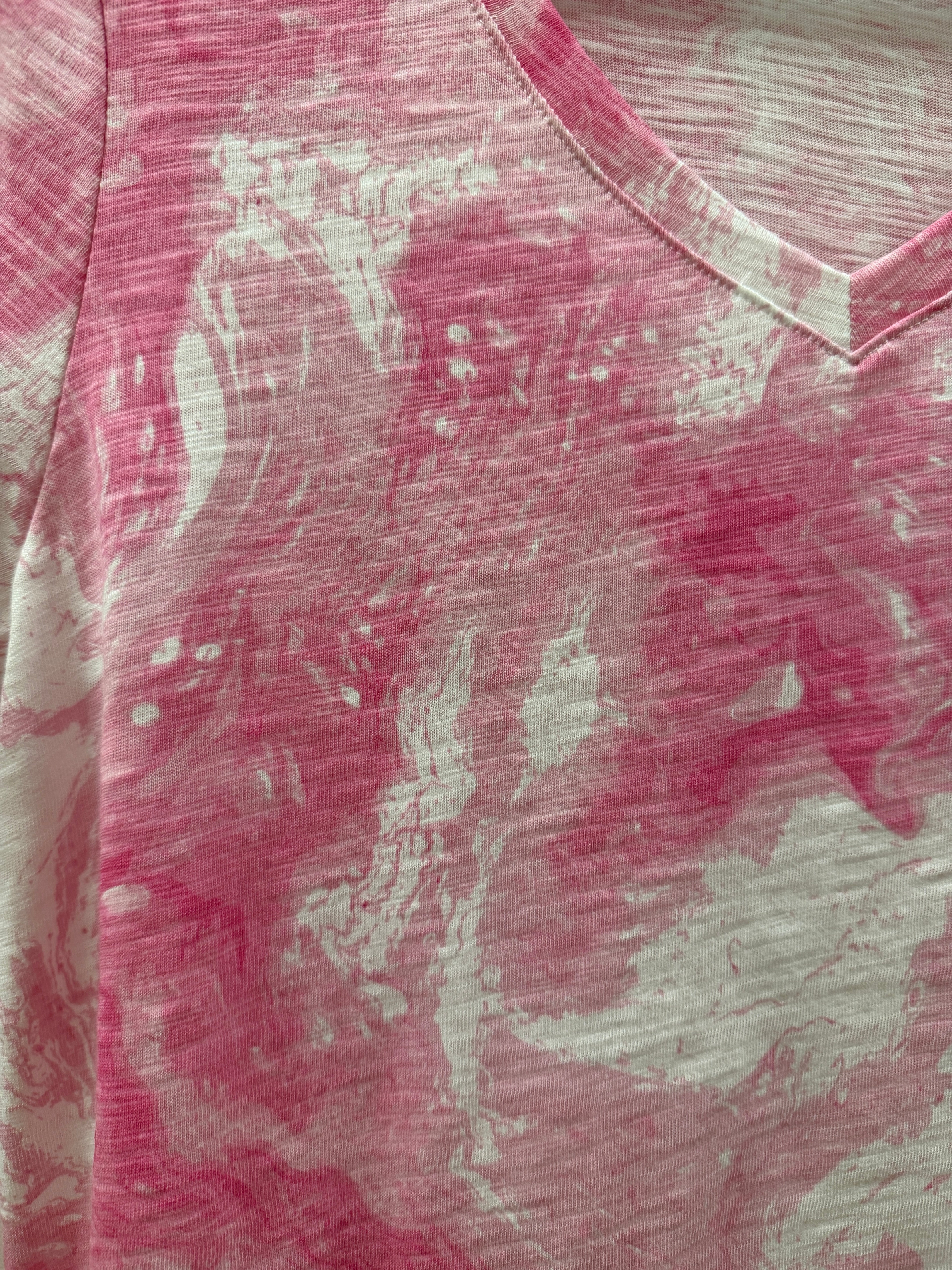 Close-up of pink fabric with a subtle pattern