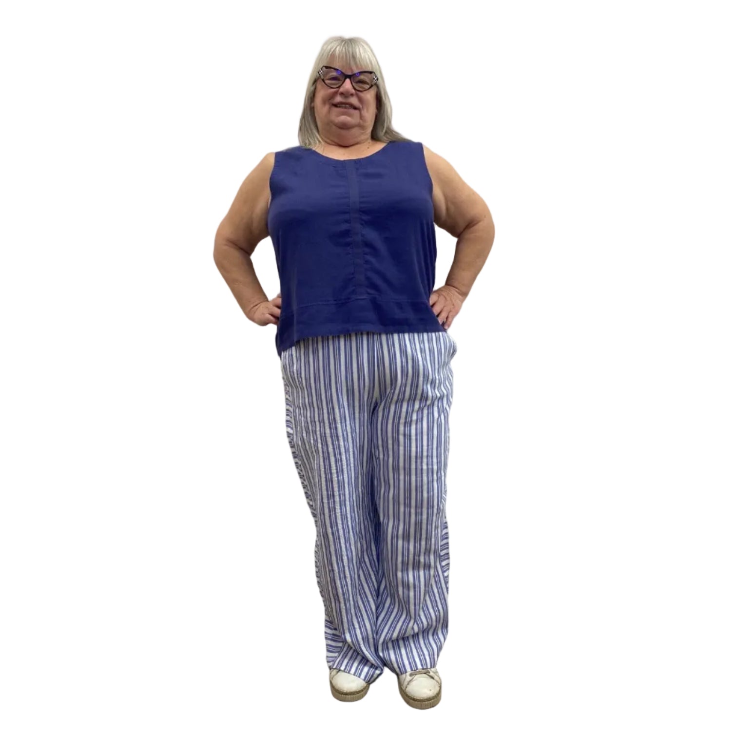 Woman wearing the Escape Harborside Flood Pants in blue and white stripe.