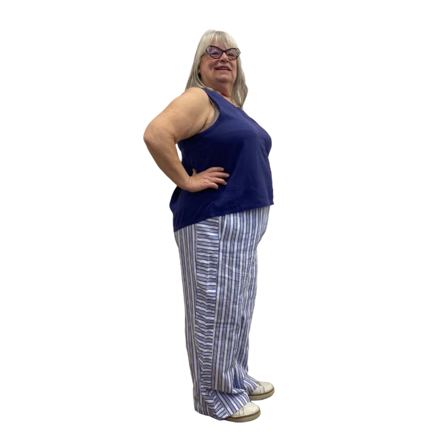 Woman wearing the Escape Harborside Flood Pants in blue and white stripe.