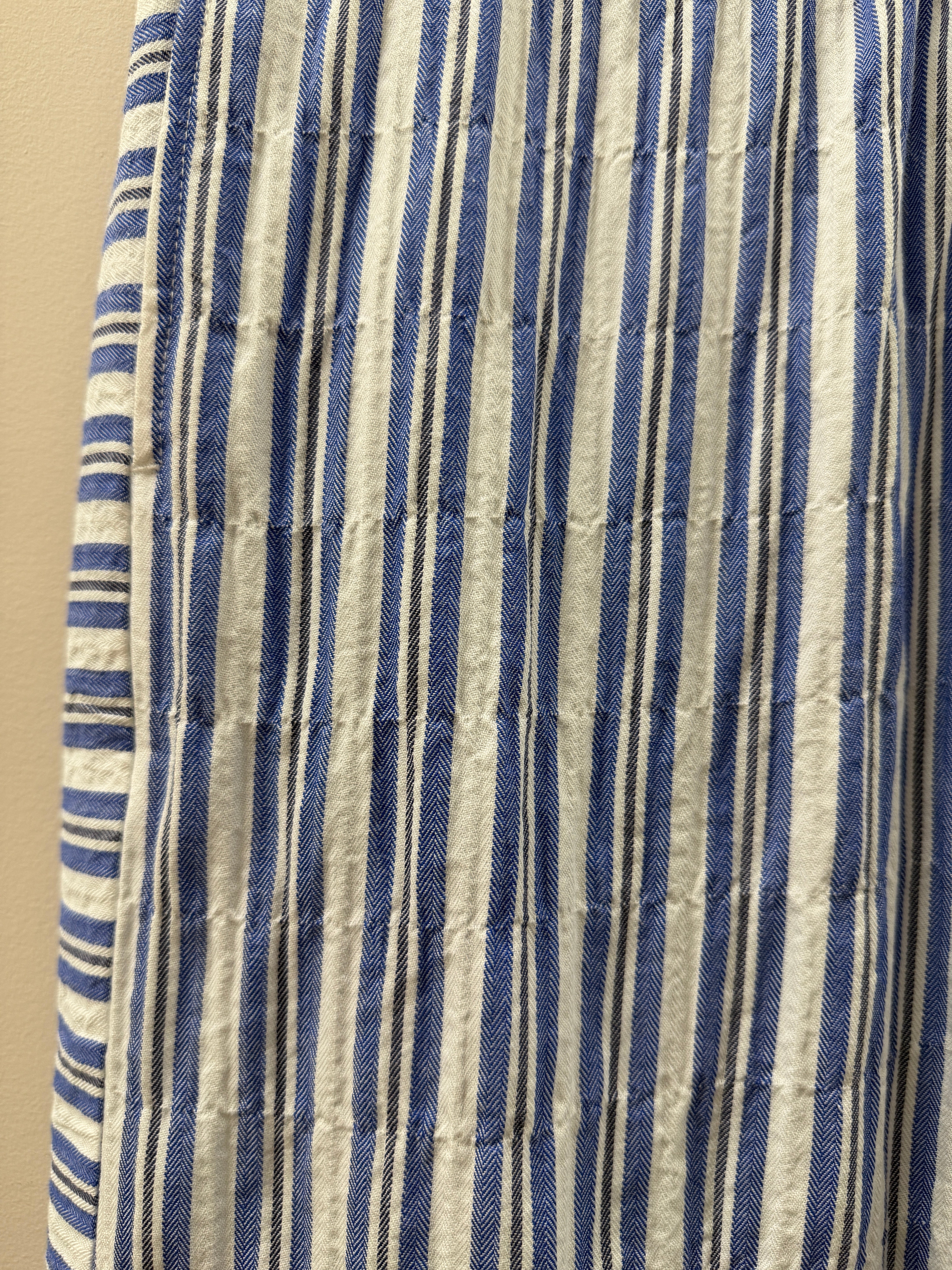 Striped fabric with blue and beige horizontal lines on a beige background