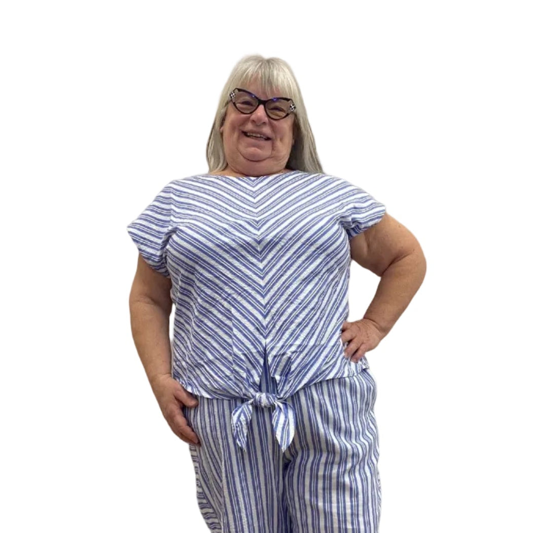 Woman wearing Escape Tie Front Top in Blue with blue and white stripes on white background.