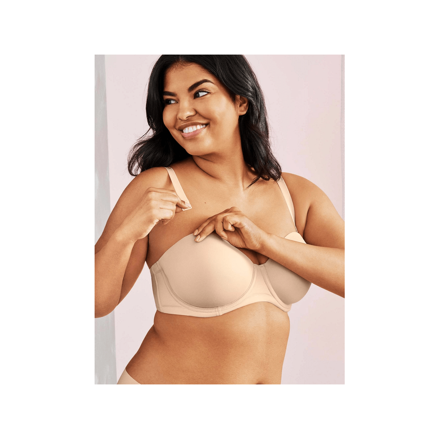 Wacoal Red Carpet Strapless Bra beige bra shown on model attaching one strap.