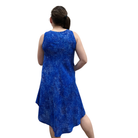 Woman wearing a blue sleeveless dress on a white background