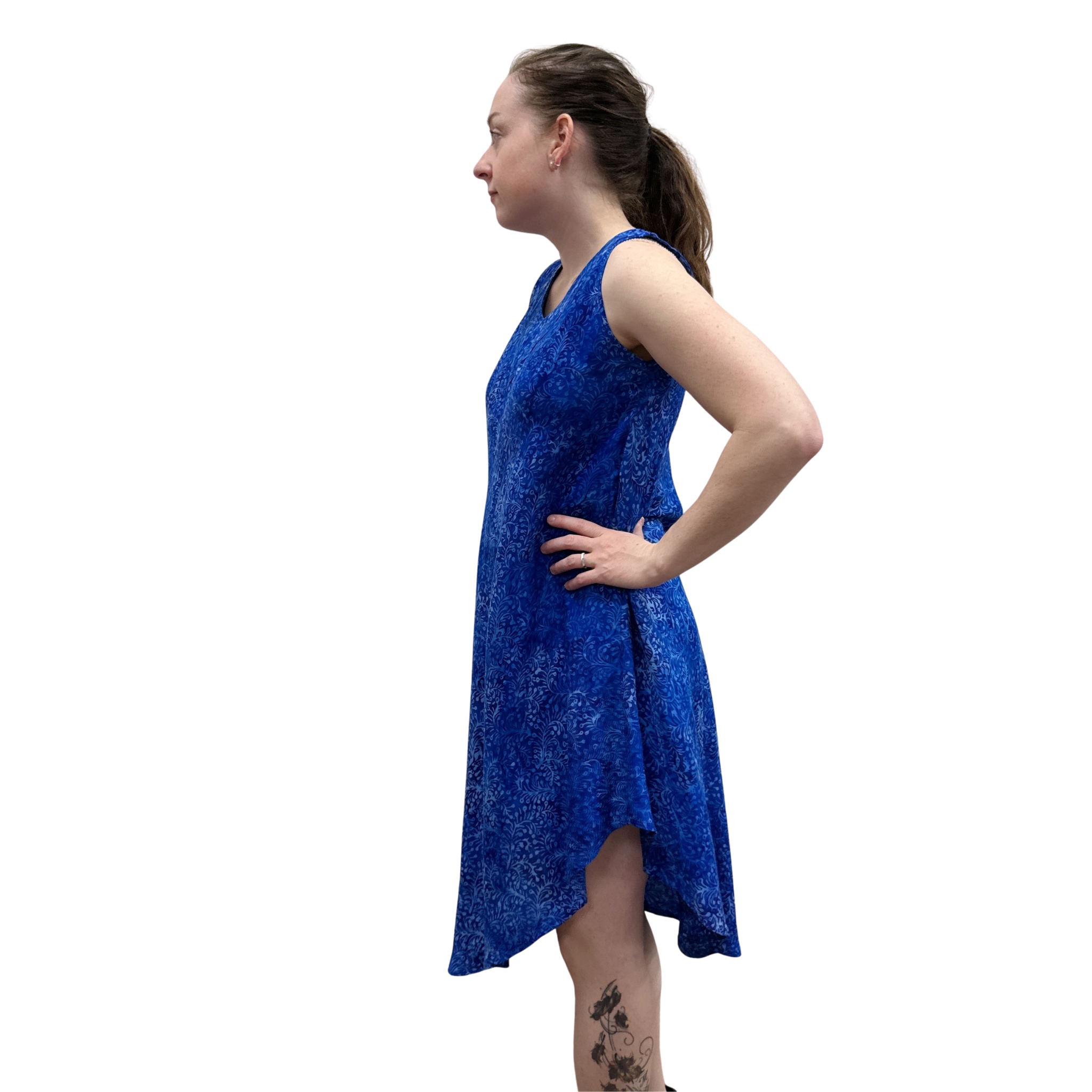 Woman wearing a blue dress against a white background