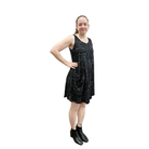 Woman wearing a black sequin dress on a white background