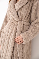 Close-up of Sensis Blair Oatmeal robe showing soft cable-knit-inspired plush texture and tie belt