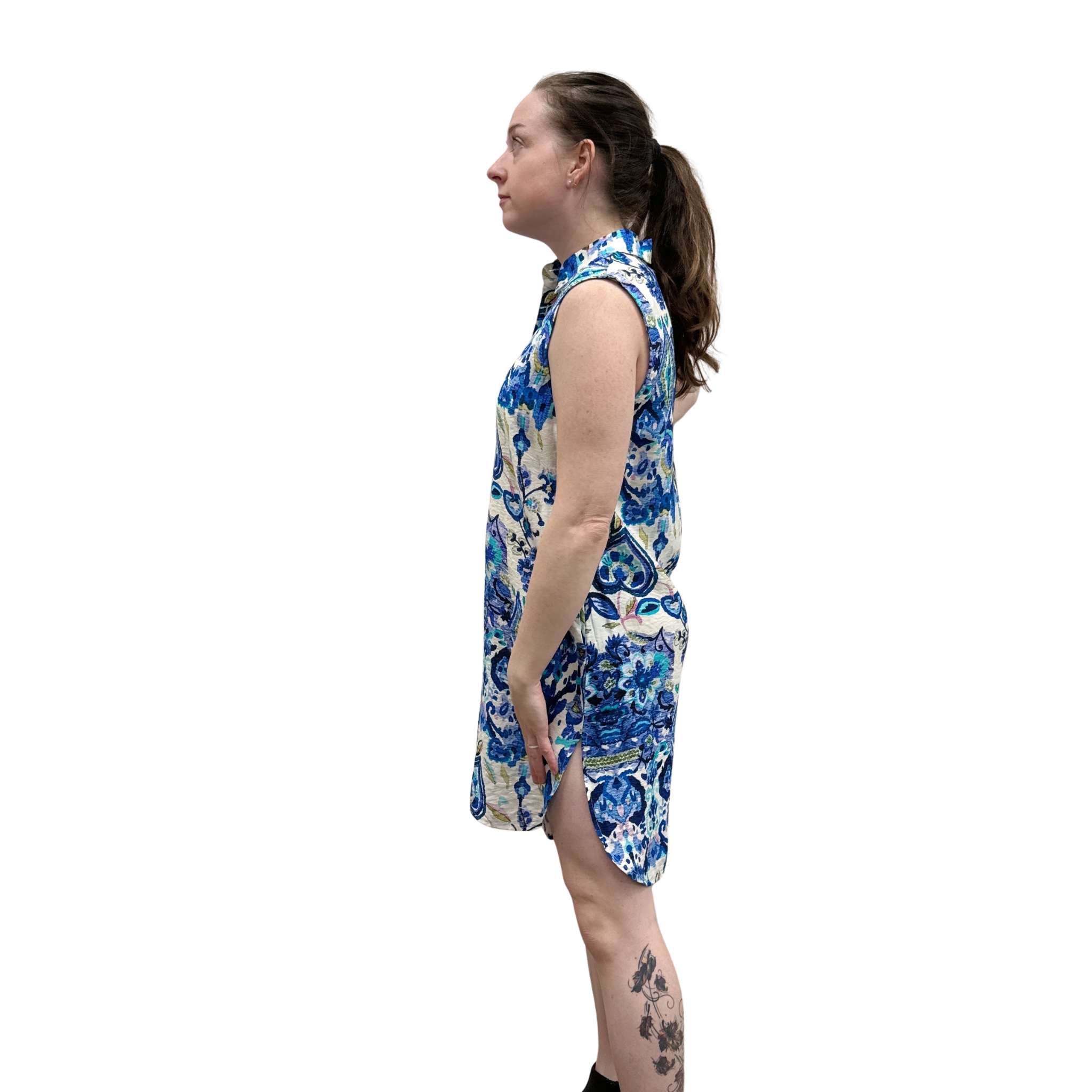 Woman wearing a blue floral dress on a white background