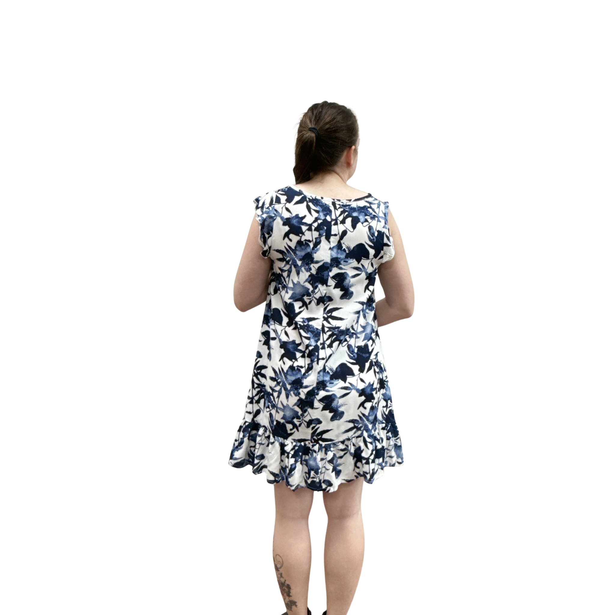 Woman wearing a blue floral dress on a white background