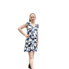 Woman wearing a floral dress on a white background