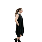 Woman wearing a black sleeveless dress on a white background