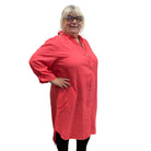 Person wearing a pink Papa Getaway Dress on white background. 