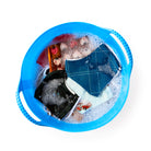Minnie Wash Basin shown from top down view so you can see water, bubbles and fabric inside soaking. 