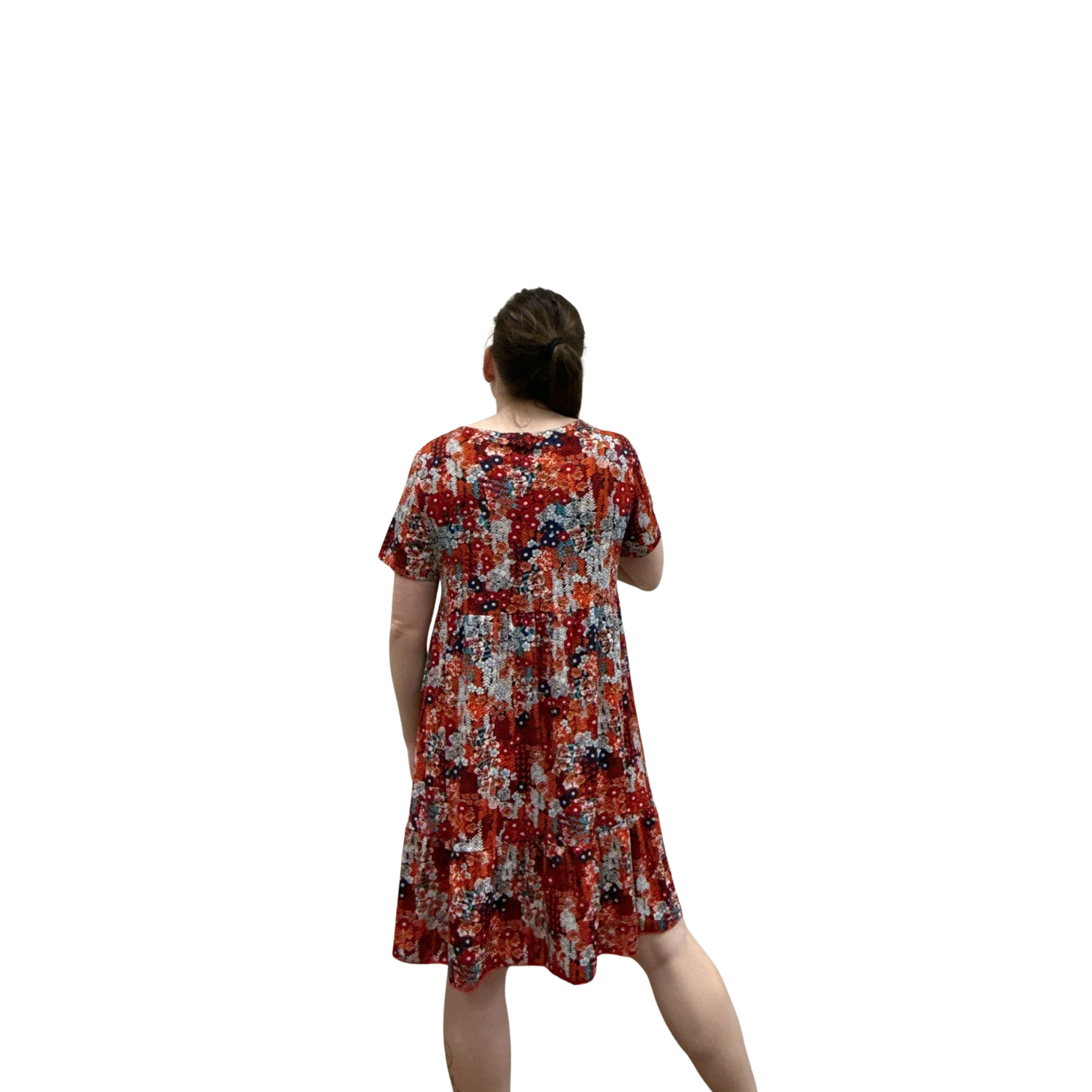 Woman wearing a red floral dress on a white background