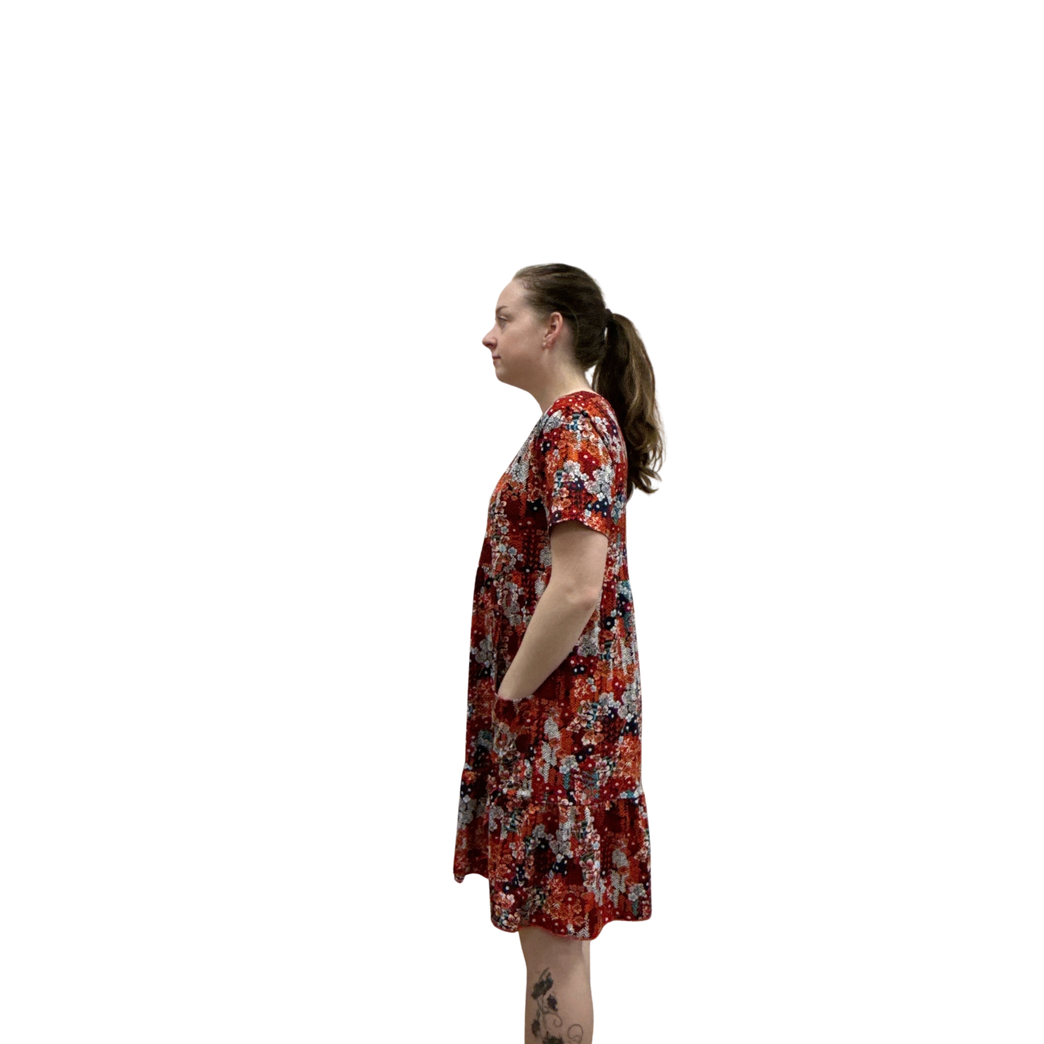 Woman wearing a floral dress on a white background