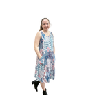 Woman wearing a floral dress on a white background