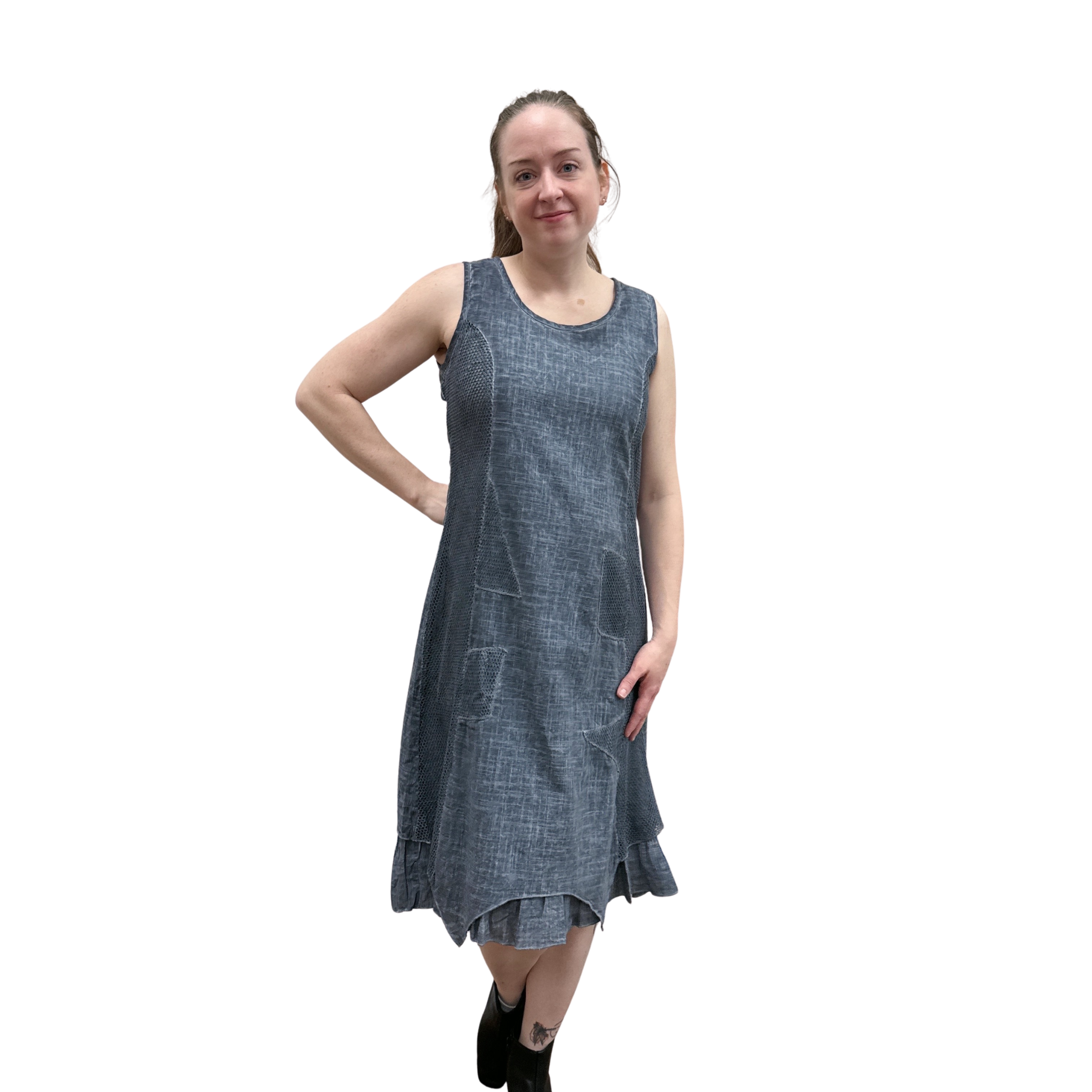 Woman wearing a blue sleeveless dress on a white background