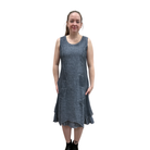 Woman wearing a blue denim dress on a white background