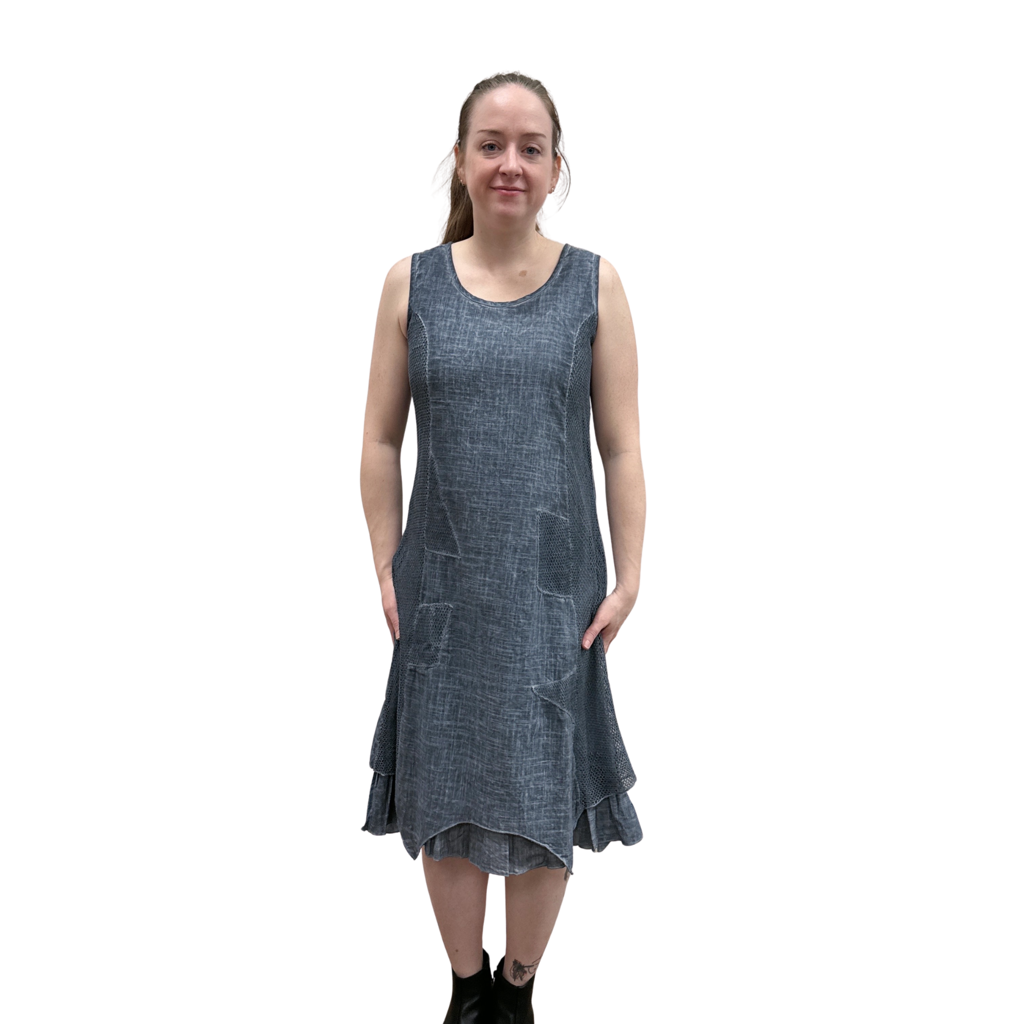 Woman wearing a blue denim dress on a white background