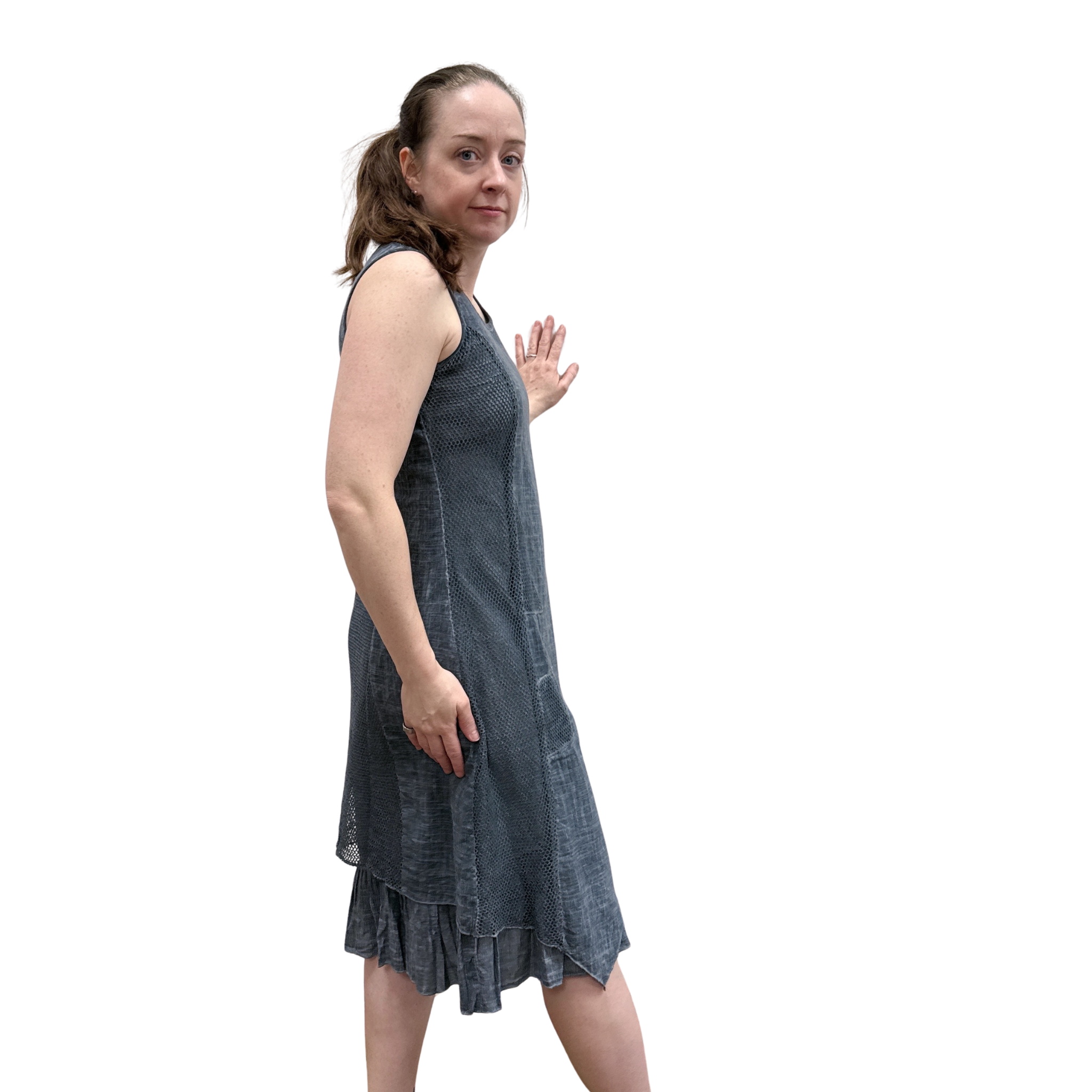 Woman wearing a denim dress on a white background
