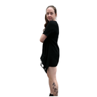 Person wearing a black dress with a white background