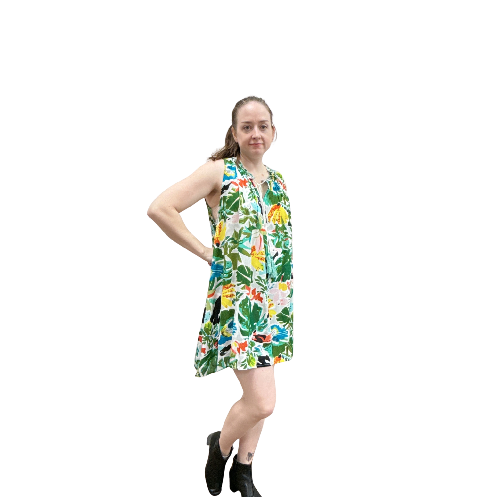 Woman wearing a colorful floral dress on a white background