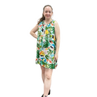 Woman wearing a colorful floral dress on a white background