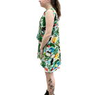 Person wearing a colorful floral dress on a white background
