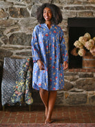 Woman wearing a blue nighty in a living room