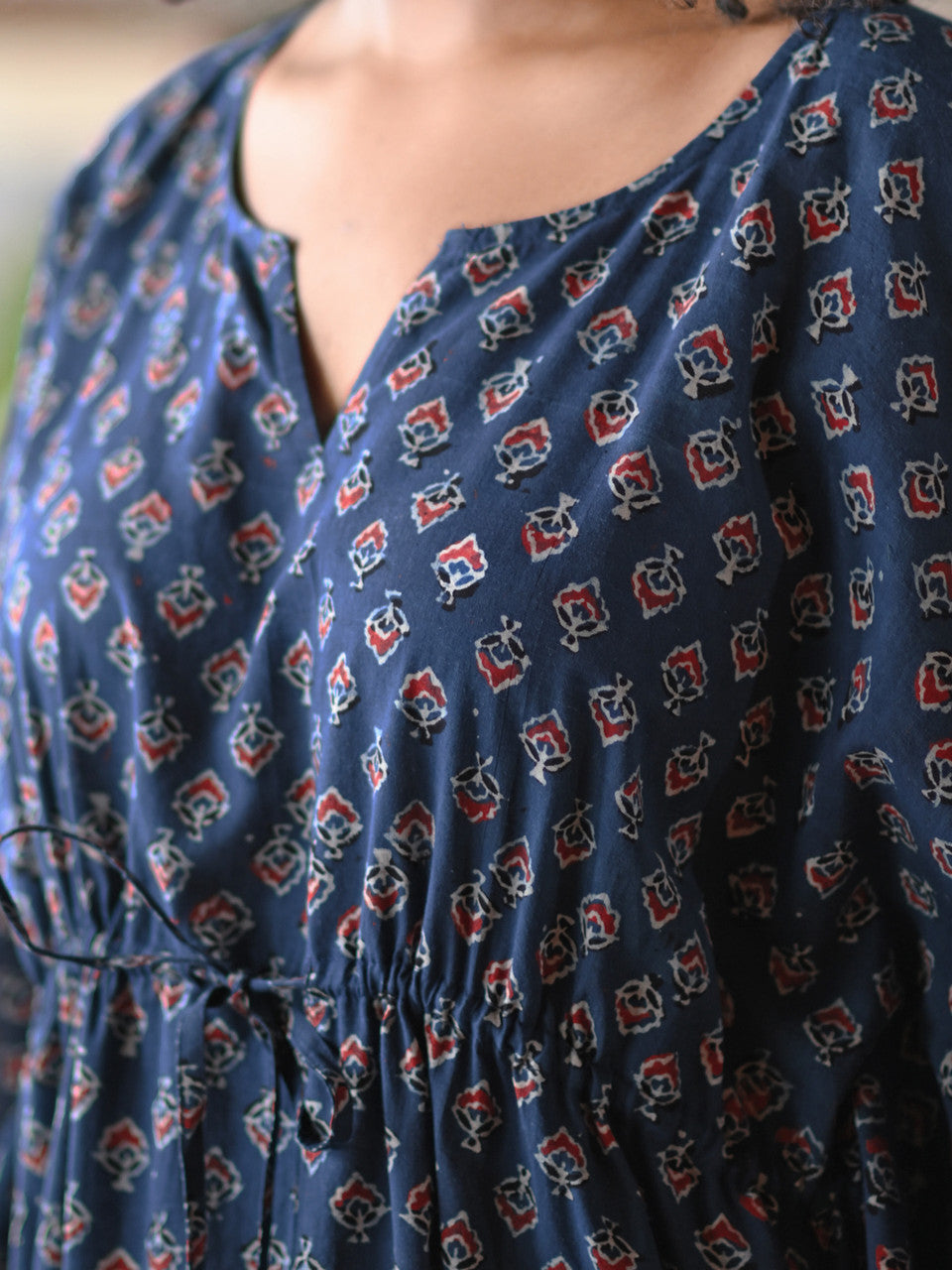 A blue and red dress with a drawstring