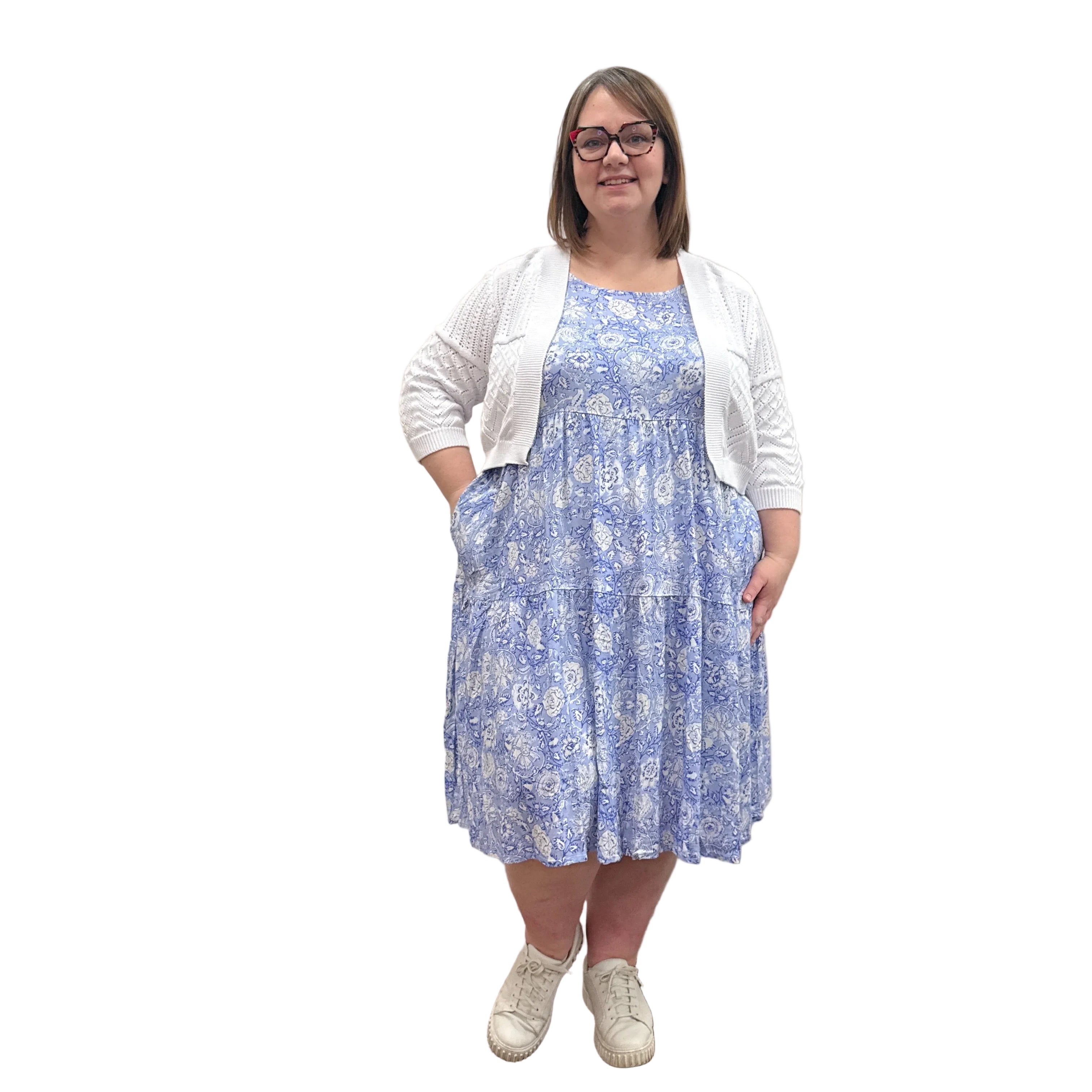 Woman wearing the Blue Sky Aldi Sweater in white over the blue Juni Dress on white background. 
