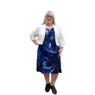 Woman wearing a white Blue Sky Aldi Sweater over a blue patterned dress on white background. 