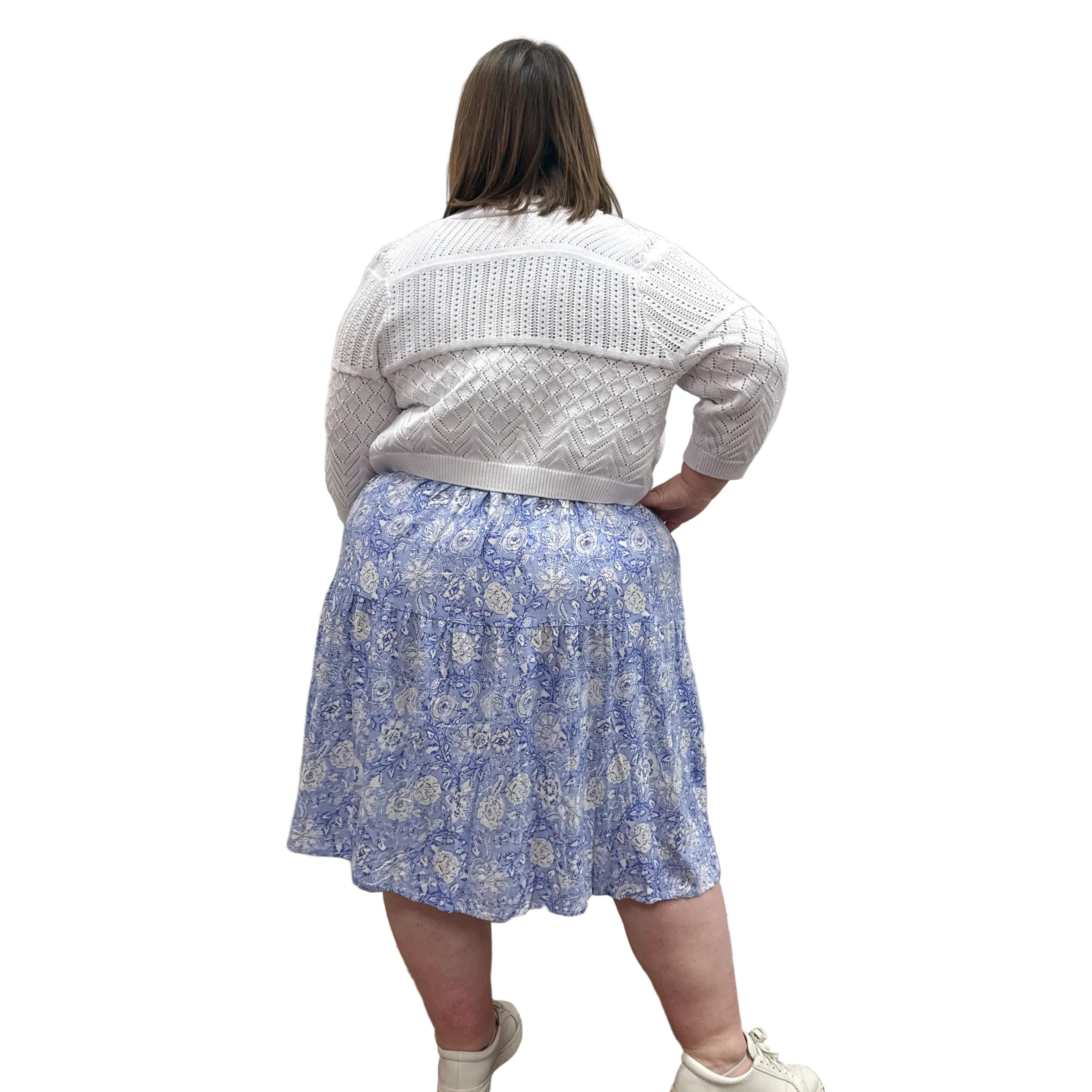 Woman wearing the Blue Sky Aldi Sweater in white over the blue Juni Dress on white background. 