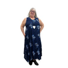 Woman wearing a navy floral Blue Sky Ari Dress on a white background. 
