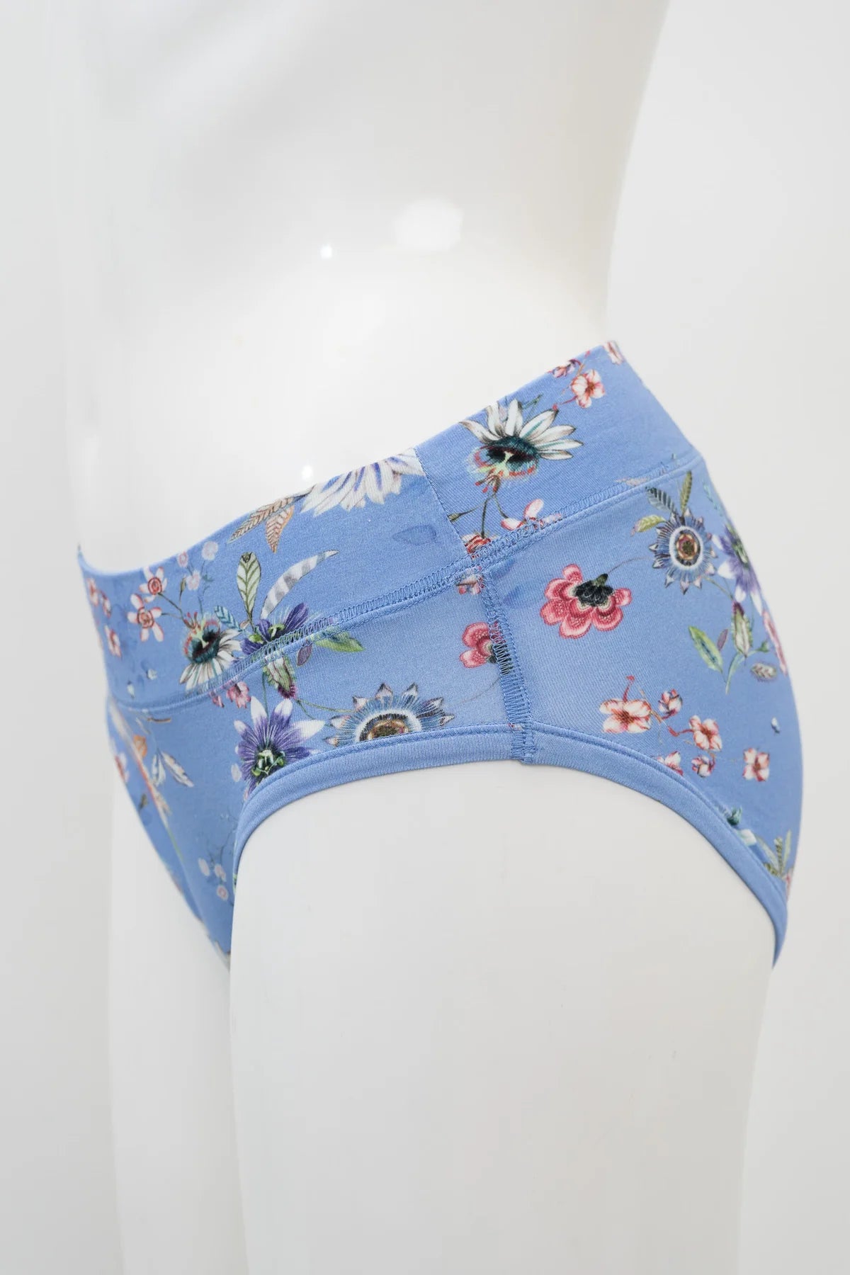 Blue floral-patterned bra on a white mannequin